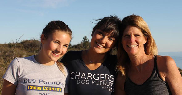 Exchange students smiling with host mom