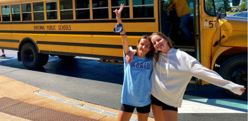 friends-in-front-of-a-yellow-school-bus 500x244px