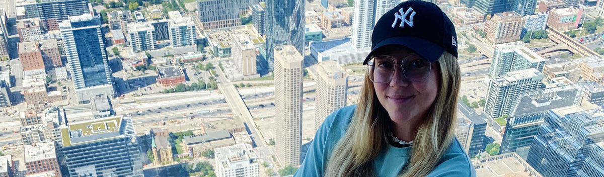 girl-glass-floor-city-view-1200x352