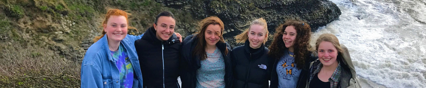Happy exchange students with view in Ireland